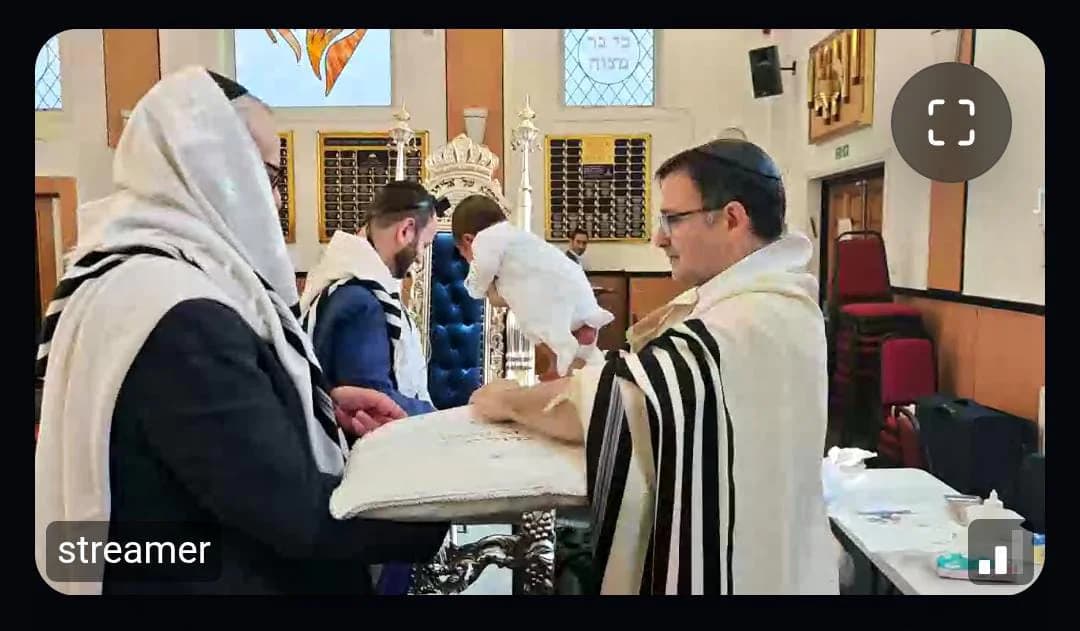 An early SimchaCam livestream of a brit milah